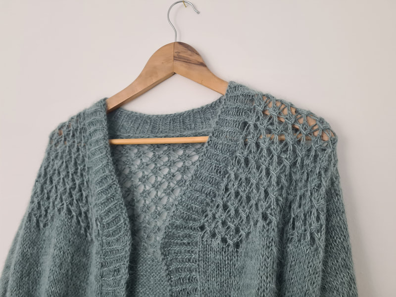 Open fronted cardigan knitting pattern. Shows zig zag lace and vee neck front